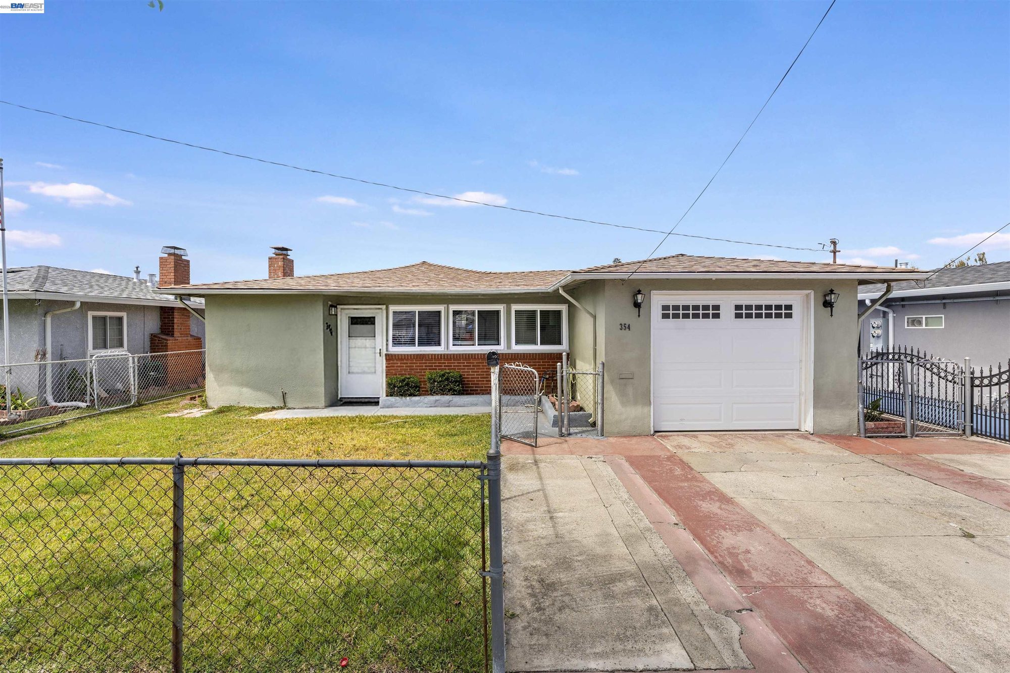 Wide driveway and attached one-car garage