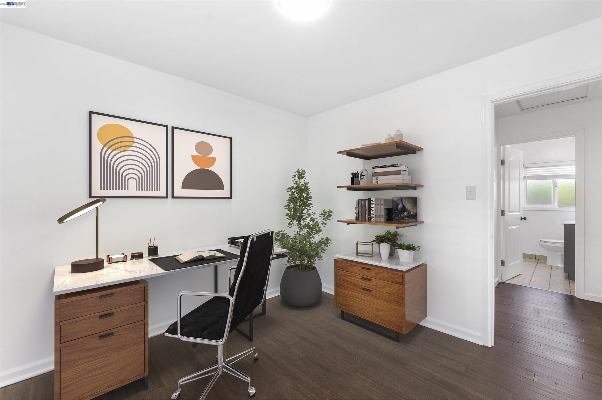 Detached bonus room staged as a home office