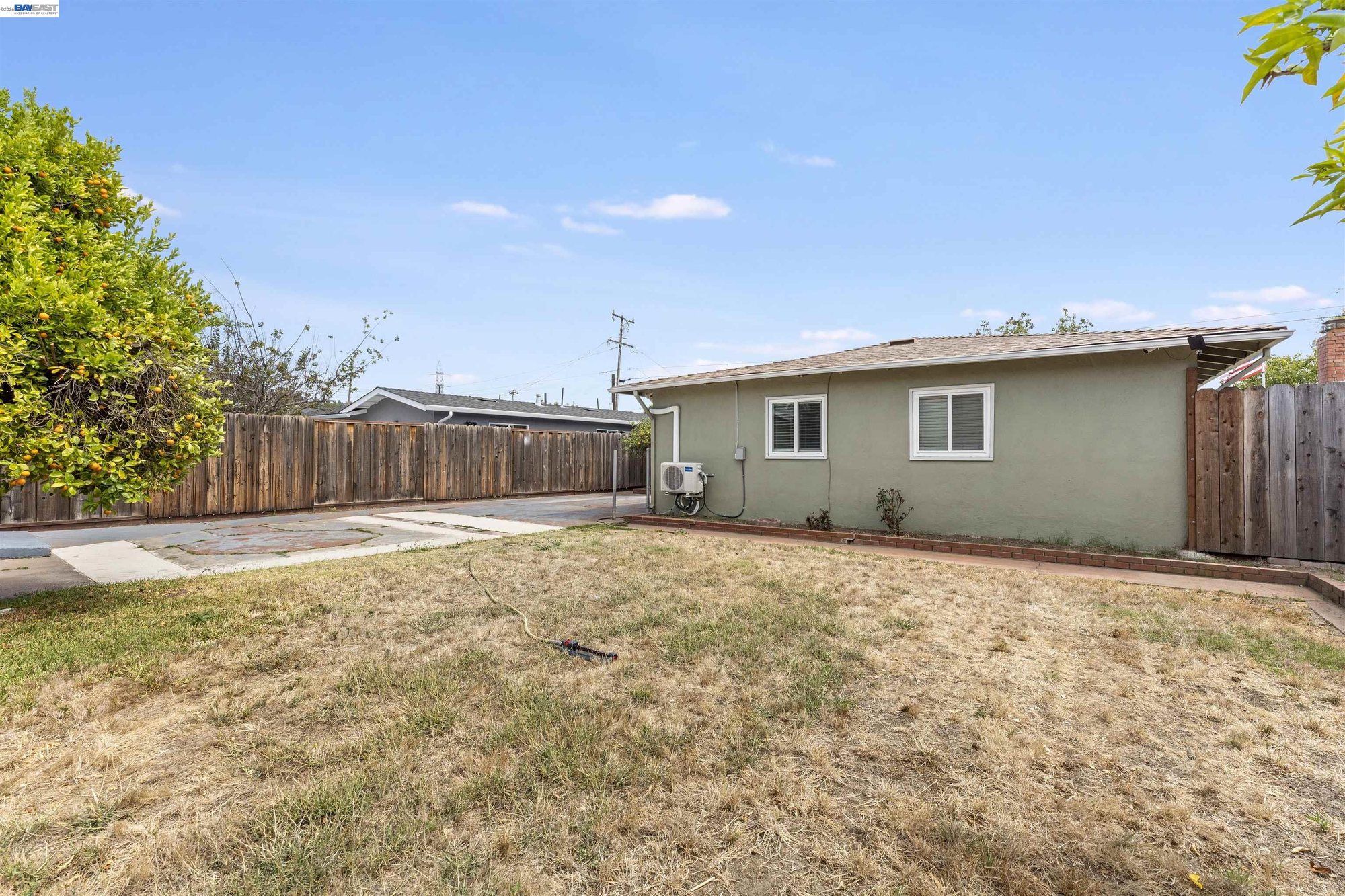 Side yard and rear elevation of the home