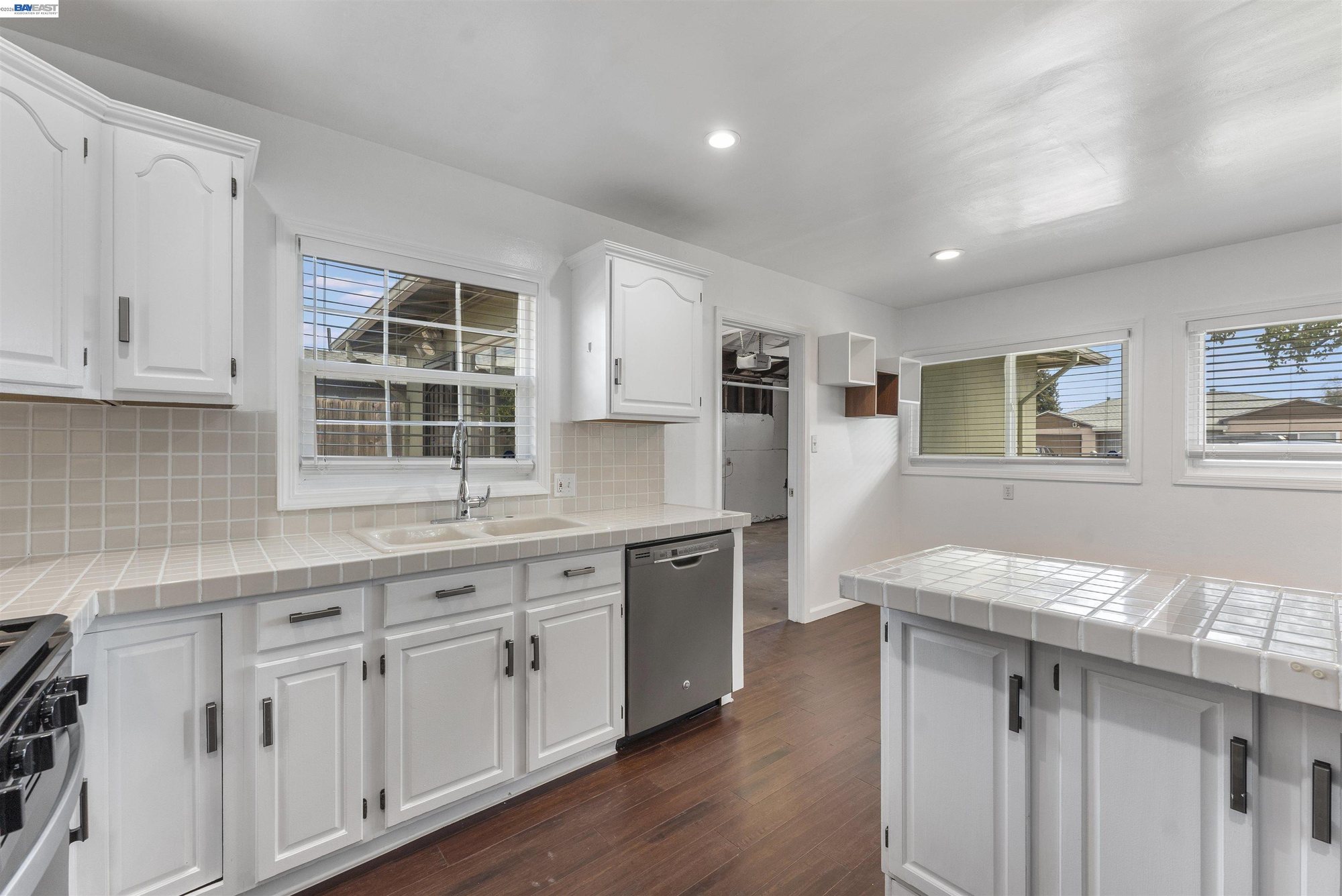 Tile counters, dishwasher, and garden window