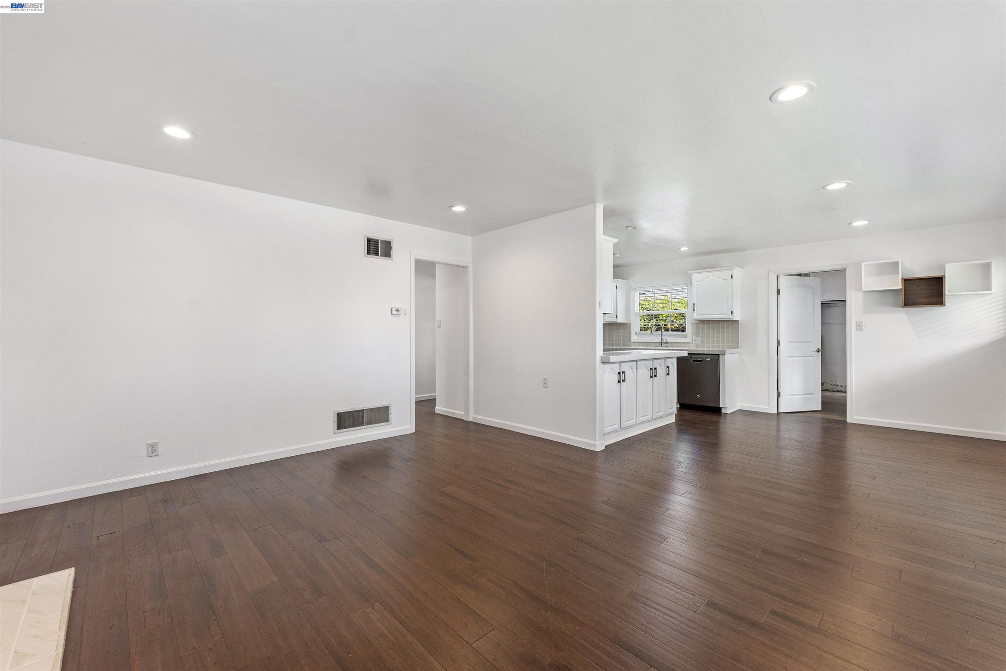 Open-concept living space with recessed lighting