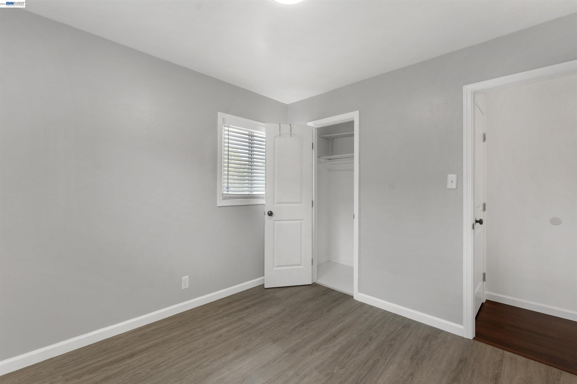 Hallway with linen and bedroom closets